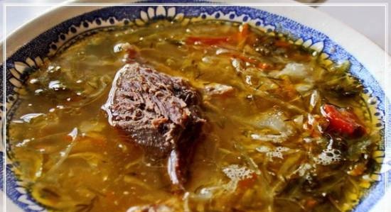 Sour cabbage soup from sauerkraut with goose