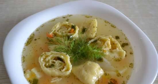 Delicious chicken soup with cheese rolls