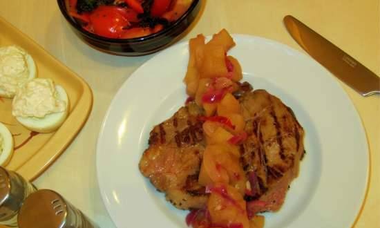 Pork steak with apple and ginger garnish