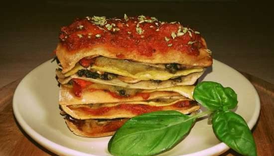 Whole wheat lasagna with tomato, celery and basil sauces in the oven
