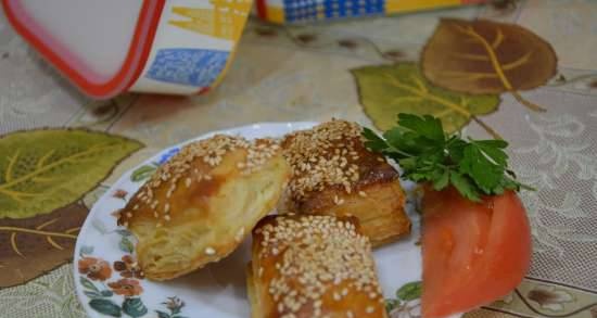Baby puffs with melted cheese and sesame seeds