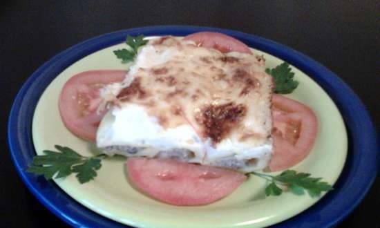 Homemade cannelloni with minced meat and mushrooms