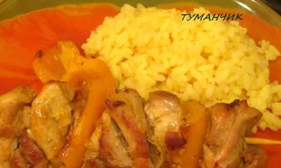 Chicken skewers in tangerine sauce with rice