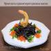 Black pasta with red caviar and crayfish oil under sour cream sauce
