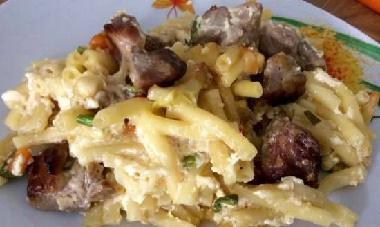 Pasta with meat in cheese sauce in the oven