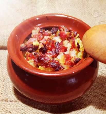 Bulgur stewed in a pot with bacon and truffle oil