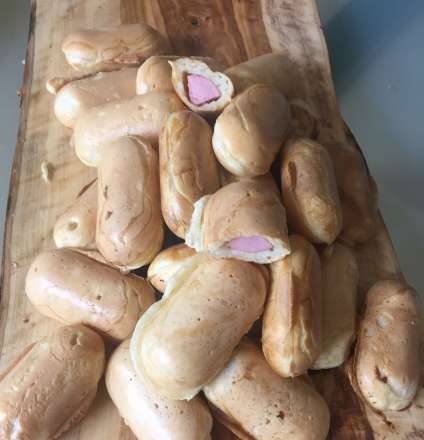 Sausages in bulk yeast dough in a Redmond multi-baker
