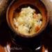 Jerusalem artichoke with crayfish tails and blue cheese in a pot