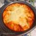 Potatoes baked in egg and sour cream sauce with mozzarella