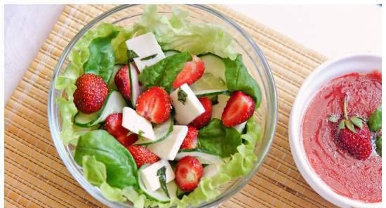 Salad with strawberries, fresh cucumbers, spinach and feta cheese