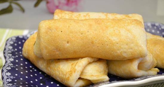 Gluten-free pancakes stuffed with stewed cabbage