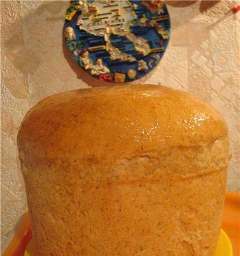Wheat bread with grains and wheat flour on dough