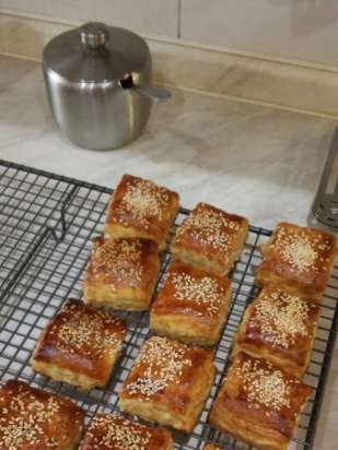 Baby puffs with melted cheese and sesame seeds