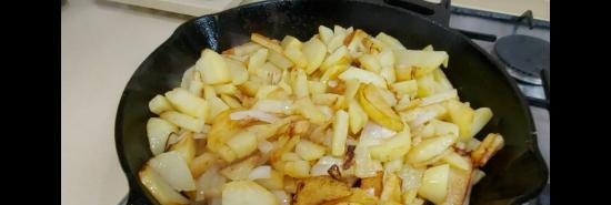 Potatoes fried in a cast-iron pan (+ video)