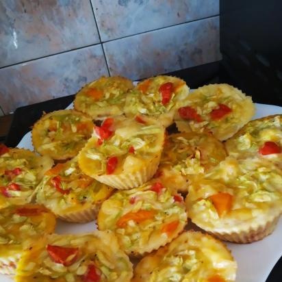 Zucchini muffins with tomato and hard cheese