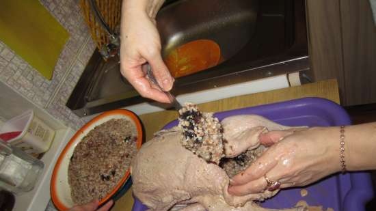 Duck stuffed with buckwheat, prunes and chicken liver, baked in a sleeve