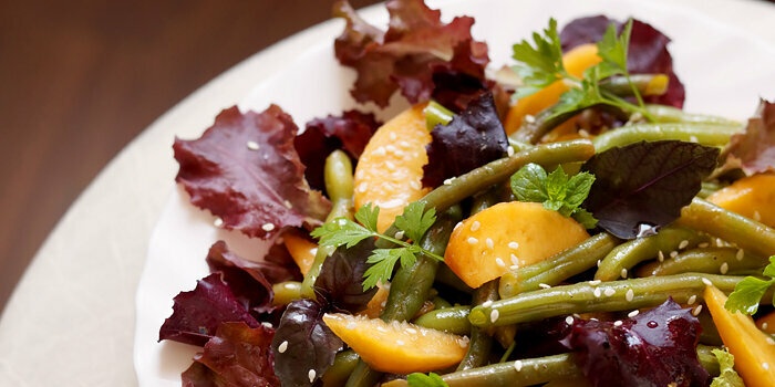 Green beans and peaches with salad dressing