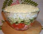 Light puff salad from vegetables, apple and sausage