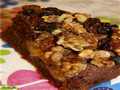 Chocolate cake with peaches and caramelized nuts