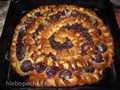 Sweet open pie with cherries and plums