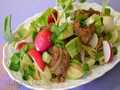 Warm salad with chicken liver, avocado, young radish
