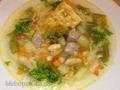 Italian vegetable soup with pasta, grilled sausage meatballs and pesto