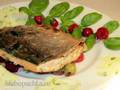 Char on a pillow of basil and caramelized berries with green creamy sauce